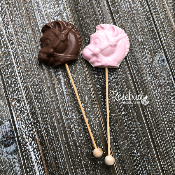 https://www.rosebudchocolates.com/cdn/shop/products/ROCKINGHORSEChocolateLollipopPartyFavors6_grande.jpg?v=1593997933